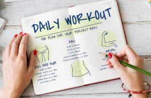 Person writing a daily workout plan in a notebook, detailing exercises for abs, arms, legs, and bum.